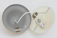 「BUBI」はHenning Koppelによって1972年にデザインされたランプで、KoppelはGeorg Jensenのデザイナーとしても名高く、同ブランドのアイコニックなシルバー製品やジュエリーを手掛けたことでも知られています。現在、「BUBI」はルイスポールセン社ではなく、他のメーカーから新品として販売されていますが、こちらはビンテージ品で、ルイスポールセン社から発売された物です。このランプのデザインは、Henning Koppelならではの滑らかなラインと、アクリルと金属を巧みに組み合わせた素材感が特徴です。シンプルでありながら、質感と形状のバランスが絶妙で、空間に洗練された印象を与えます。