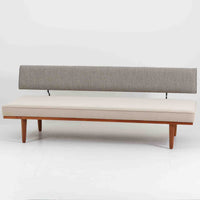 Severin Hansen Jr.(セヴェリン・ハンセン)によるデザインで、Haslev社から発表されたソファベッドです。繊細な脚部やチーク材のフレームにハンセンらしいシャープなラインが際立ち、軽やかで洗練された印象を与えます。背もたれは回転させることで、簡単に位置を変えることができ、シーンに合わせてソファとしてもデイベッドとしてもお使いいただける実用的な構造です。張地には落ち着いたトーンのファブリックを用い、北欧らしい穏やかな空気感を演出。経年により艶を増したチーク材の風合いが、上質なビンテージ家具の存在感を際立たせています。