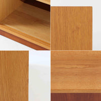 Borge Mogensenがデザインし、Karl Andersson社により製造されたこちらのディスプレイシェルフは、チーク材とオーク材のコントラストが美しいスウェーデン製の北欧ビンテージ家具です。上部はオープン構造で5段の棚が左右に配されており、書籍や器、小物のディスプレイに最適で、下部にはスライド扉収納も備え実用性にも優れています。幅135cmと存在感のあるサイズながら、直線的で端正な佇まいが空間に凛とした印象を与える一台です。