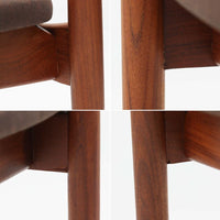 Kai Kristiansenがデザインし、Magnus Olesenが製作したTrojaアームチェアです。アフロモシア材の滑らかな木肌と深みのある色合いが美しく、背からアームへと一体で削り出されたフレームが身体をやさしく包み込みます。わずかに湾曲した笠木や細身の脚部が軽快な印象を与え、立ち座りの動作も自然。張り替え済みの座面は快適な掛け心地を備え、ダイニングや書斎空間に北欧ビンテージならではの気品と造形美をもたらす一脚です。ロゴは、デンマークの家具販売店(小売店)である Brdr. Ellehuus(エルフース兄弟店) のものです。