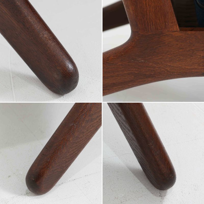 Hans J. Wegnerがデザインし、Getamaが製作したGE290Aハイバックシングルソファです。ダークオーク材の堅牢なフレームは丸みを帯びたアームと後方へ傾斜した脚部が特徴で、身体をやさしく受け止める構造美が際立ちます。張り替えられた落ち着いた色調のクッションは、内部にビンテージ特有のスプリングを内包し、程よい弾力と快適な座り心地を実現。読書や寛ぎの時間に最適で、経年により深みを増した木部の質感が北欧ビンテージならではの存在感と上質な雰囲気を空間に添える一脚です。