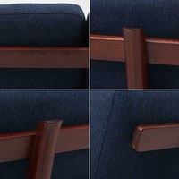 こちらは、ウェグナーデザインの人気モデル、GE236の3人掛けソファです。後ろ姿が非常に美しいため、あえて壁に寄せず背面を見せる配置もおすすめです。クッション内部にはスプリングが内蔵されており、座り心地も良好です。さらに、こちらは現地でも希少なアフロモシア材（通称アフリカンチーク）が使用された特別なモデルです。GE236のチーク材仕様として一般的に認識されているのは、このアフロモシア材が使用されたモデルを指します。GETAMA社の刻印も確認できます。